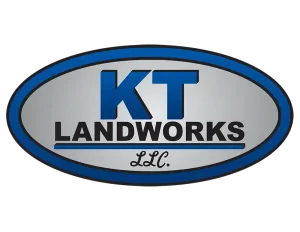 Logo for KT Landworks LLC, featuring bold blue lettering on a silver oval background.