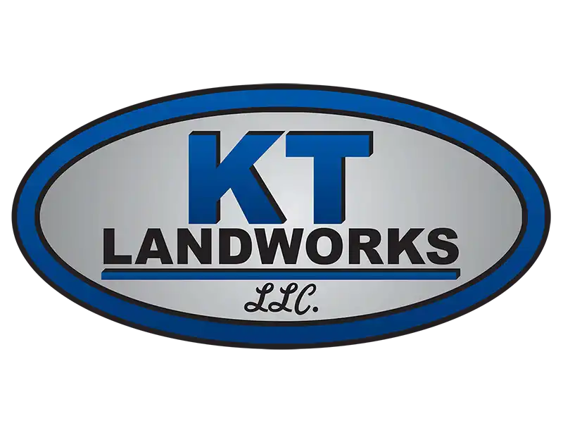 Logo for KT Landworks LLC, featuring bold blue lettering on a silver oval background.